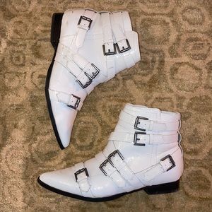 White leather buckled ankle boots